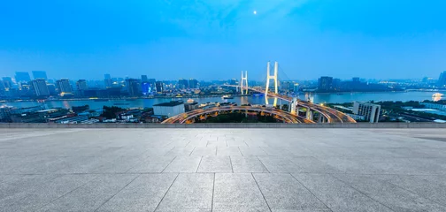 Cercles muraux Pont de Nanpu Empty square floor and bridge buildings at night in Shanghai,China