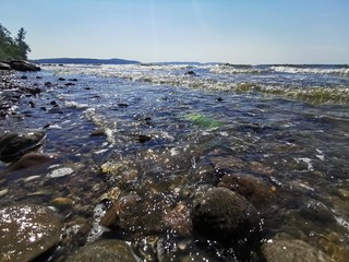 the beach with waves and sunshine