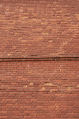 red brick wall texture grunge background with vignetted corners,