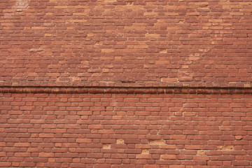 red brick wall texture grunge background with vignetted corners,