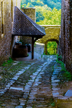 Europe,France,Midi-Pyrenees,Aveyron,Conques,Sainte-Foy, Saint James way, street of the village, stone track