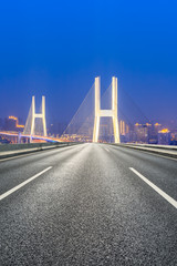Fototapeta na wymiar Empty highway and Nanpu bridge at night in Shanghai,China