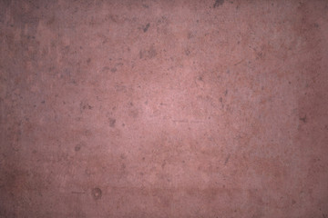 Pink dark edged grunge background overlaid with grungy elements.