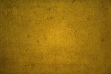 Dark edged golden background overlaid with grungy elements