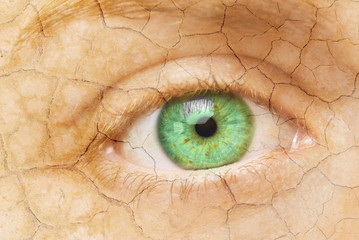 Cracked Skin. Closeup of a female eye with cracked skin. Aging process or pain and loneliness...