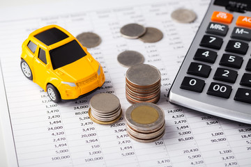 Car, coins with calculator