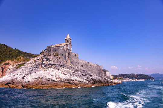 Portovenere, Cinque Terre, Liguria, Italy - August 09, 2018 - View of the ancient church of San Pietro (St. Peter consecrated in 1198) in Portovenere  (UNESCO world heritage site)
