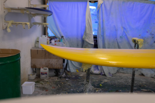 Painted surfboard in workshop