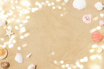 Fototapeta na wymiar vacation and summer holidays concept - seashells on beach sand