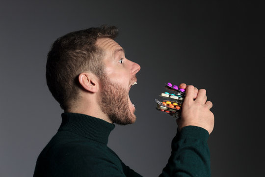 30 years old man eating medicine sandwich