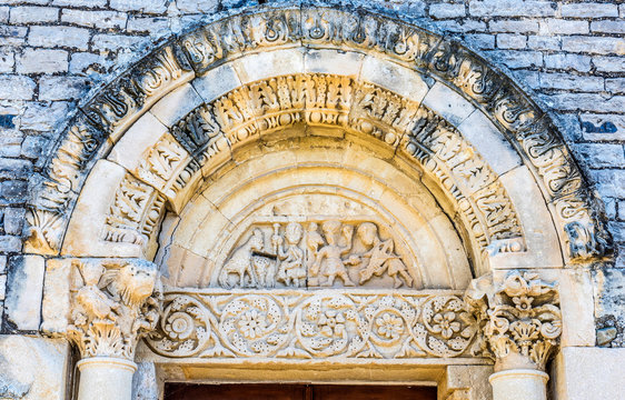 France, Drome, The Provencal Baronnies Regional Natural Park, Sainte Jalle village, church Notre Dame de Beauvert (12th century), gate decorated with culmns with capitals and sculpted abacus