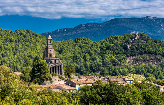 France, Drome, The Provencal Baronnies Regional Natural Park, Pierrelongue, rocky peak restructured in the 19th century to recieve the church Notre Dame de la Consolation