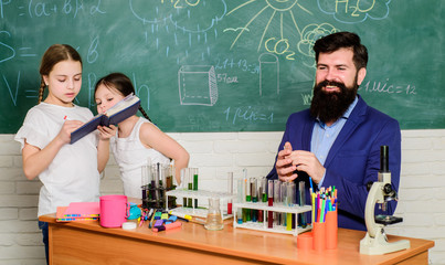 back to school. biology education. Microscope. experimenting with chemicals or microscope at laboratory. Biology school laboratory equipment. happy children & teacher. Scientist at work