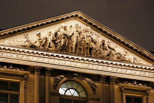 Paris. 1st district. Louvre Museum by night. Square courtyard. Facade of the pavilions. Architectural detail.