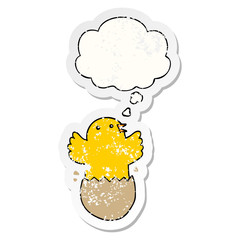 cartoon hatching bird and thought bubble as a distressed worn sticker