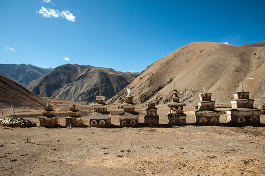 ch&ouml;rten in a row on desertic mountain landscape, Dolpo, Nepal