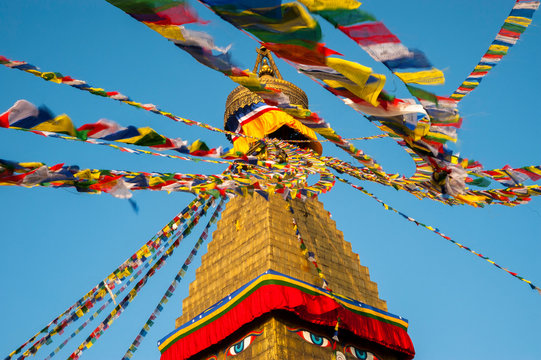 Prayer flags in the wind all around the chörten, Bodhnath, Nepal