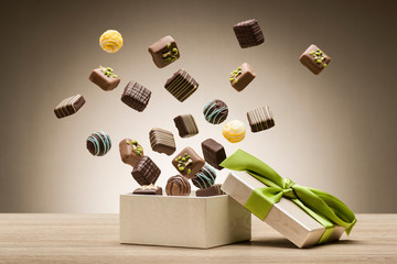 mix of chocolates jumping from gift box