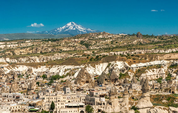 Turkey, Goreme National park and rock sites of Cappadocia, city of Uchisar and snow-covered Erciyes Mountain (former volcano, 3917 meters high) (UNESCO World Heritage)