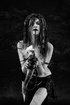 Portrait of a shaman holding a steaming horn