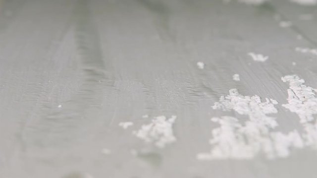 Chemical paint stripper removing white color from wooden surface