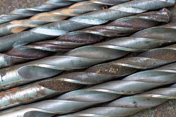 Fototapeta premium old drills lie in a row, background