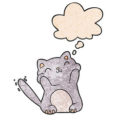 cartoon cat and thought bubble in grunge texture pattern style