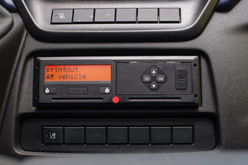 Fototapeta premium Digital tachograph display reads Printout Vehicle. No personal data. Tachograph in a van