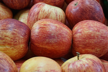 Fresh bunch of ripe red apples in the market
