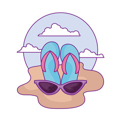 flip flops with sunglasses in the beach