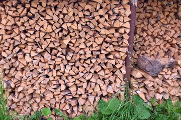 stack of cut firewood for a log burning stove in countryside