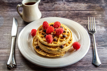 Chocolate chip waffles with raspberries