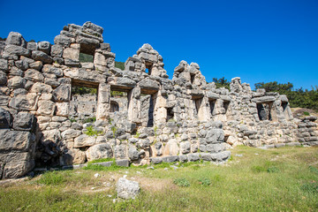 Fototapeta na wymiar Ancient Lycian City of Arykanda. Overview of the gymnasium complex. Arykanda is an ancient city built on mountain terraces at an altitude of 1000 meter. It is an amazing ancient city. Antalya-Turkey