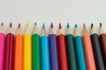 Fototapeta premium Colored pencils close-up on a white background. Macro. Flat lay