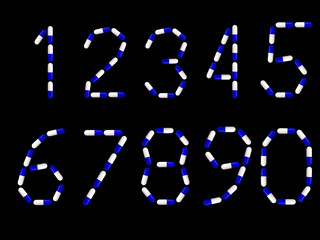 numbers 1, 2, 3, 4, 5, 6, 7, 8, 9, 0 written in blue and white medical capsules, isolated on a black background