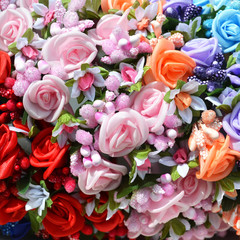 Wall of small rosebuds. colorful panorama of rainbow shades from red to blue. Roses - flowers of romance and love. Panoramic view