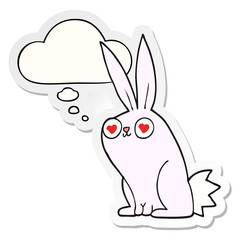 cartoon bunny rabbit in love and thought bubble as a printed sticker