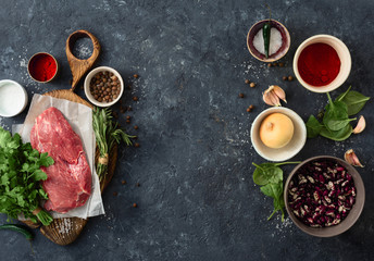 Food menu. Cooking table with beef meat, vegetables, spices, beans and herbs top view
