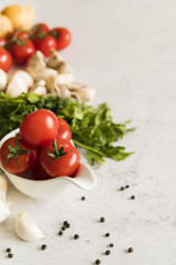 Fototapeta na wymiar Fresh tomatoes, mushrooms and parsley