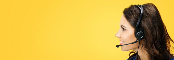 Customer support phone sales female operator in headset with emty copy space area for some text or...