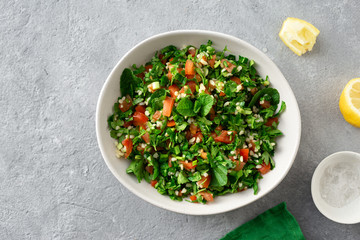 Healthy summer tabule salad bowl top view copy space