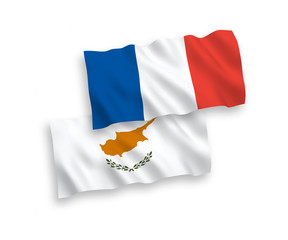 National vector fabric wave flags of France and Cyprus isolated on white background. 1 to 2 proportion.