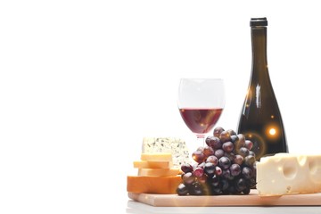 Wine Bottle, Wine Glass, Cheese and Grape on the Wooden Platter