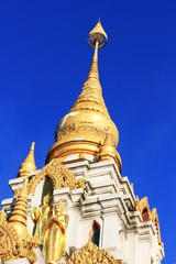 Golden pagoda in temple located on the mountain and very beautiful view in Chiangrai Province, Thailand.