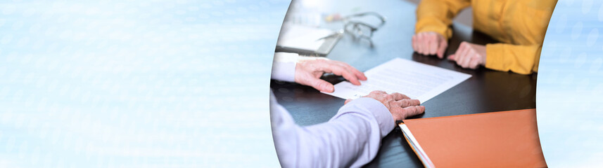 Business negotiation between businesswoman and businessman, light effect; panoramic banner