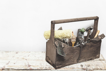 Carpentry box with tools. Vintage carpentry tools: hummer, ax, pruner, pliers
