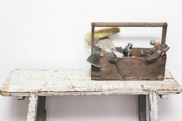 Carpentry box with tools. Vintage carpentry tools: hummer, ax, pruner, pliers