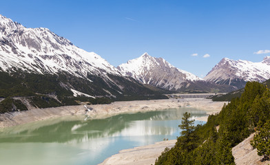 Obraz na płótnie Canvas Alpine landscape with artificial lake, italy