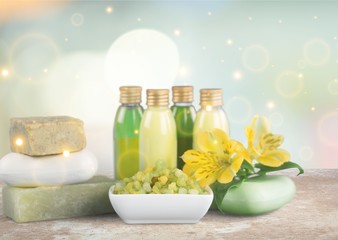 Bottles with organic essential aroma oils on background