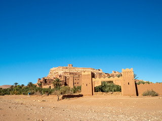 Ait Ben Haddou Kasbah, old medieval town in Morocco desert, castle fort gate, clay mud houses ruins, river in the mountiains